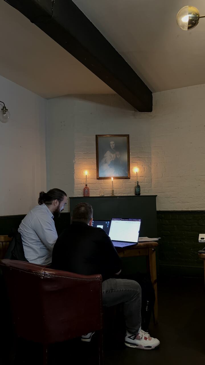Two people building a flow together on a laptop
